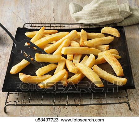 Stock Image - Chunky chips on baking sheet. Fotosearch