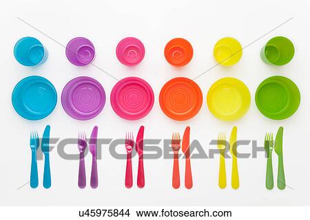 Picture - Colourful plastic plates, cups, bowls and cutlery. Fotosearch