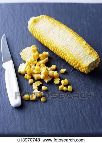 Corn on the cob and knife View Large Photo Image Stock Photo - Corn on the cob and knife. Fotosearch