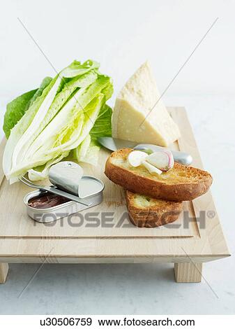 Cos lettuce, parmesan, bread, garlic and anchovies View Large Photo Image Stock Photo - Cos lettuce, parmesan, bread, garlic and anchovies. Fotosearch