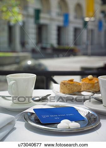 Credit card left on restaurant table View Large Photo Image Stock Photo - Credit card left on restaurant table. Fotosearch