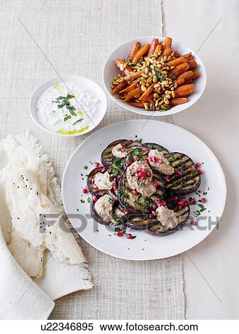 Eggplant salad, yoghurt dip, and Moroccan carrot salad View Large Photo Image Stock Photography - Eggplant salad, yoghurt dip, and Moroccan carrot salad. Fotosearch