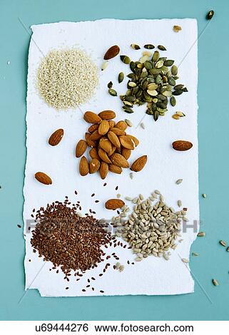 Stock Photograph - Flax seeds, pumpkin seeds, sunflower seeds and almonds. Fotosearch