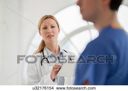 Focus on female doctor with digital tablet View Large Photo Image Picture - Focus on female doctor with digital tablet. Fotosearch