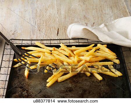 Frites on baking sheet View Large Photo Image Picture - Frites on baking sheet. Fotosearch