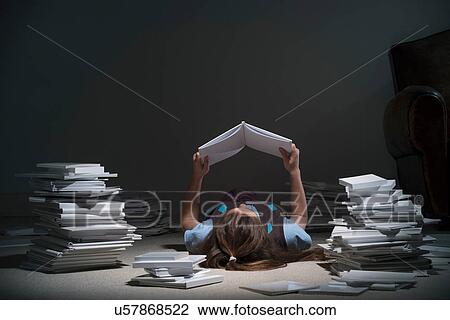 Girl lying on back reading book View Large Photo Image Stock Image - Girl lying on back reading book. Fotosearch