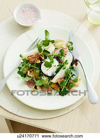 Goats Cheese, pear and hazelnut salad with bitter leaves View Large Photo Image Stock Image - Goats Cheese, pear and hazelnut salad with bitter leaves. Fotosearch