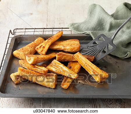 Honey roast parsnips on baking tray with green cloth View Large Photo Image Stock Image - Honey roast parsnips on baking tray with green cloth. Fotosearch