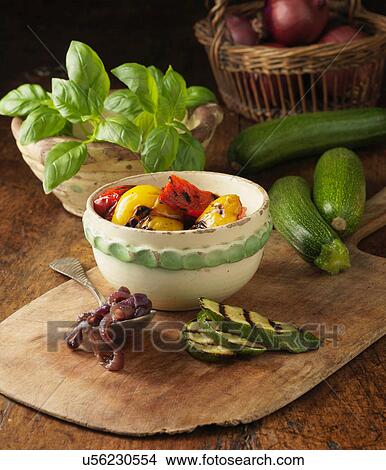 Ingredients for char grilled vegetable and basil pesto pizza on rustic pizza board View Large Photo Image Picture - Ingredients for char grilled vegetable and basil pesto pizza on rustic pizza board. Fotosearch