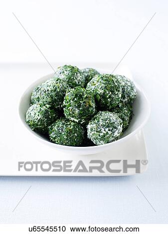 Stock Image - Labna rolled with herbs. Fotosearch