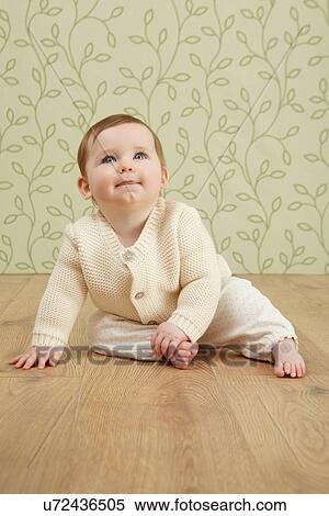 Stock Photography - Little girl looking up. Fotosearch