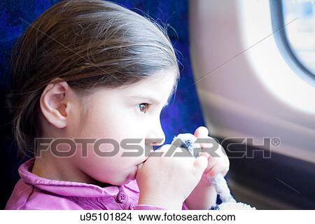 Little girl on train, sucking thumb View Large Photo Image Picture - Little girl on train, sucking thumb. Fotosearch