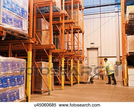 Man working in warehouse View Large Photo Image Stock Photography - Man working in warehouse. Fotosearch