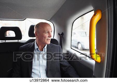 Mature businessman in black cab, London, England, UK View Large Photo Image Picture - Mature businessman in black cab, London, England, UK. Fotosearch