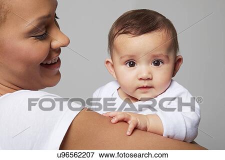 Stock Photo - Mother and her baby girl. Fotosearch