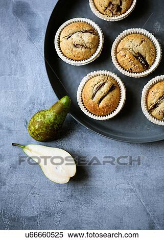 Stock Photography - Muffins with pears. Fotosearch