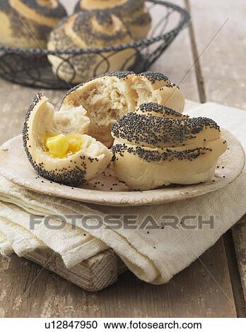 Poppy seed rolls with butter on cream linen napkin View Large Photo Image Stock Image - Poppy seed rolls with butter on cream linen napkin. Fotosearch