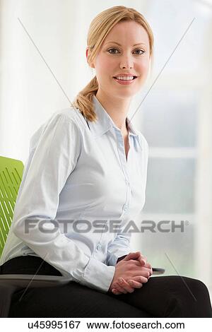 Stock Photo - Portrait of blonde businesswoman. Fotosearch