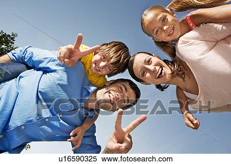 Portrait of family with two children from below View Large Photo Image Stock Photography - Portrait of family with two children from below. Fotosearch