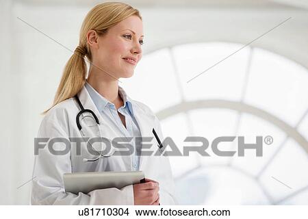 Picture - Portrait of female doctor with stethoscope and digital tablet. Fotosearch