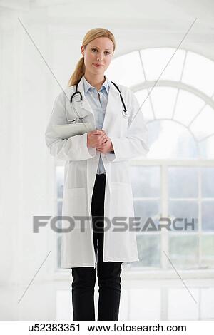 Portrait of female doctor with stethoscope and digital tablet View Large Photo Image Stock Image - Portrait of female doctor with stethoscope and digital tablet. Fotosearch