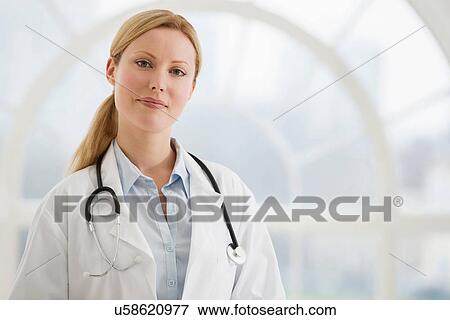 Portrait of female doctor with stethoscope View Large Photo Image Stock Photo - Portrait of female doctor with stethoscope. Fotosearch