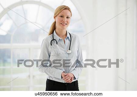 Stock Photograph - Portrait of female doctor with stethoscope. Fotosearch