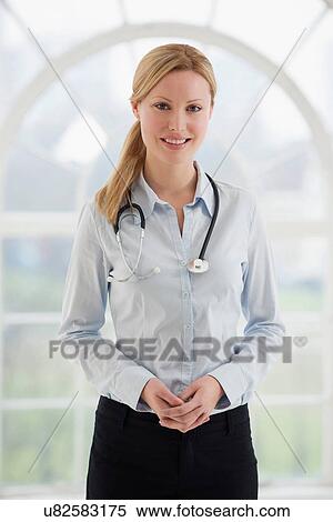Portrait of female doctor with stethoscope View Large Photo Image Stock Photography - Portrait of female doctor with stethoscope. Fotosearch