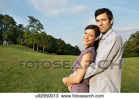Portrait of mid adult couple, looking at camera View Large Photo Image Stock Image - Portrait of mid adult couple, looking at camera. Fotosearch