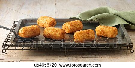 Potato croquettes on baking sheet on wire rack View Large Photo Image Stock Image - Potato croquettes on baking sheet on wire rack. Fotosearch