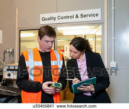 Stock Image - Quality control in a factory. Fotosearch