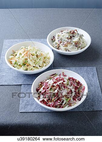 Radicchio slaw with walnut dressing, coleslaw and potato salad View Large Photo Image Picture - Radicchio slaw with walnut dressing, coleslaw and potato salad. Fotosearch