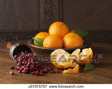 Recipe ingredients for dry cured gammon with clementines and cranberries. Whole and halved clementines with scoop of cranberries View Large Photo Image Stock Photo - Recipe ingredients for dry cured gammon with clementines and cranberries. Whole and halved clementines with scoop of cranberries. Fotosearch