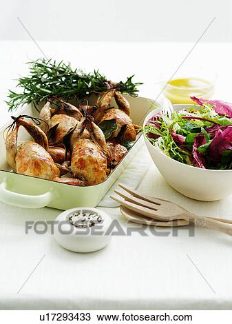 Stock Image - Roast quail and mixed salad. Fotosearch