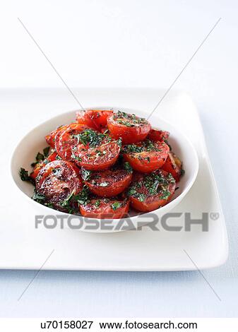 Stock Photo - Roasted cherry tomatoes. Fotosearch