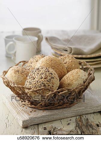 Stock Photograph - Selection of bread rolls, mixed seed and whole grain. Oats, poppy seeds, pumpkin seeds. Fotosearch