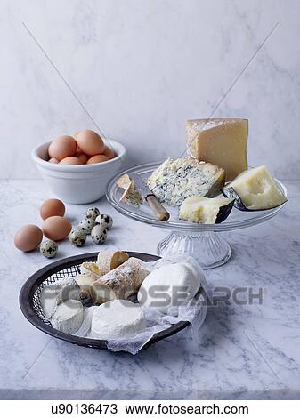 Stock Image - Selection of cheese and eggs. Fotosearch