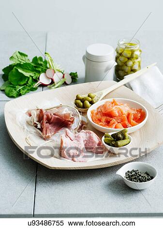Stock Photography - Selection of cured meats and pickles. Fotosearch