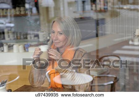 Senior woman sitting on coffee shop View Large Photo Image Stock Photography - Senior woman sitting on coffee shop. Fotosearch