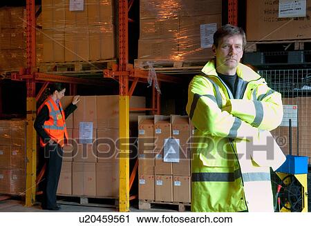 Serious male supervisor in warehouse View Large Photo Image Stock Image - Serious male supervisor in warehouse. Fotosearch