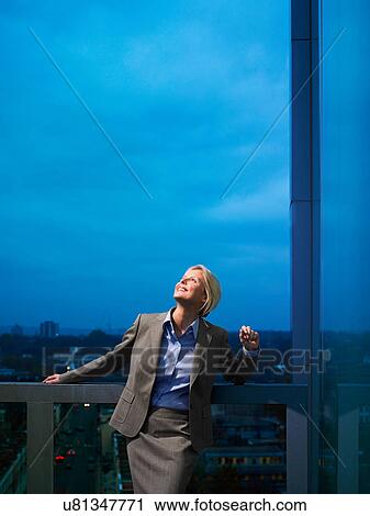 Smart lady in corporate environment overlooking the city View Large Photo Image Stock Image - Smart lady in corporate environment overlooking the city. Fotosearch