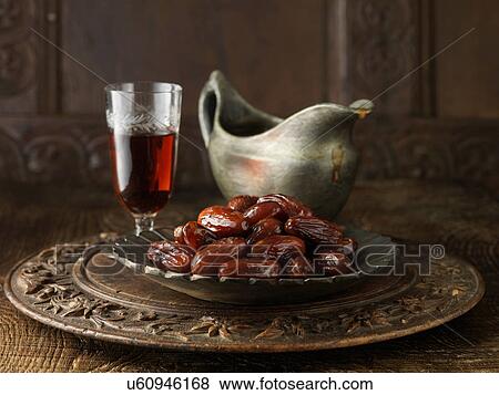 Speciality gravy containing dates and sherry on carved circular board with gray jug and crackers View Large Photo Image Stock Photo - Speciality gravy containing dates and sherry on carved circular board with gray jug and crackers. Fotosearch
