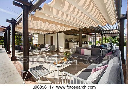 Stock Photo - Sun terrace at holiday resort. Fotosearch