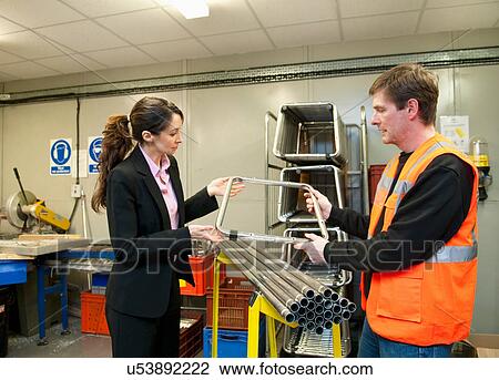 Supervisor inspecting components in electrical part factory View Large Photo Image Stock Image - Supervisor inspecting components in electrical part factory. Fotosearch