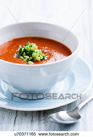 Stock Photography - Tomato soup with leek garnish. Fotosearch