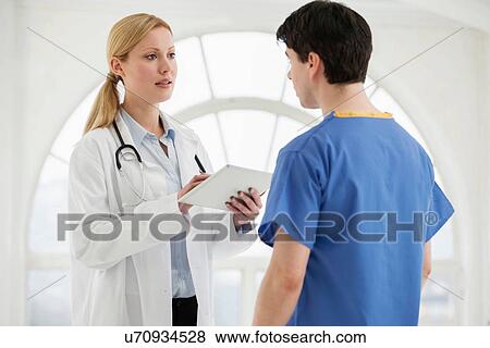 Two doctors in discussion View Large Photo Image Stock Photo - Two doctors in discussion. Fotosearch