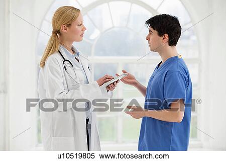 Two doctors in discussion View Large Photo Image Stock Photography - Two doctors in discussion. Fotosearch
