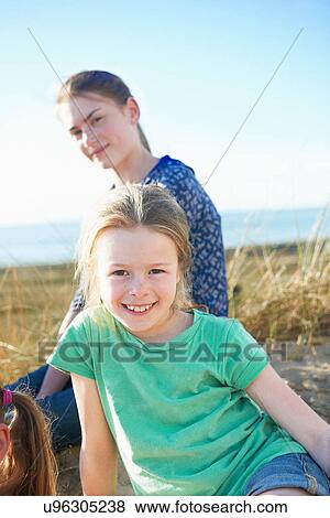 Two girls on beach View Large Photo Image Stock Photo - Two girls on beach. Fotosearch