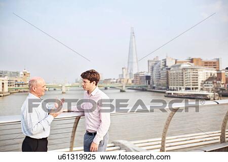 Two men on Millennium Bridge, London, England, UK View Large Photo Image Stock Photography - Two men on Millennium Bridge, London, England, UK. Fotosearch