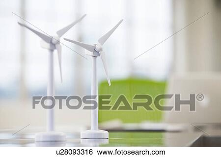 Stock Photograph - Two models of wind turbines on desk. Fotosearch